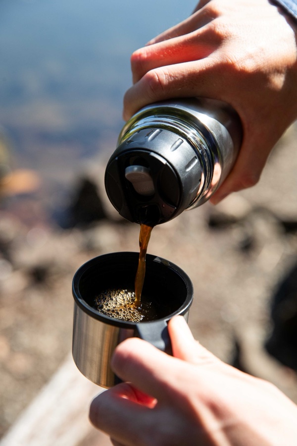 Guide making coffee outdoors