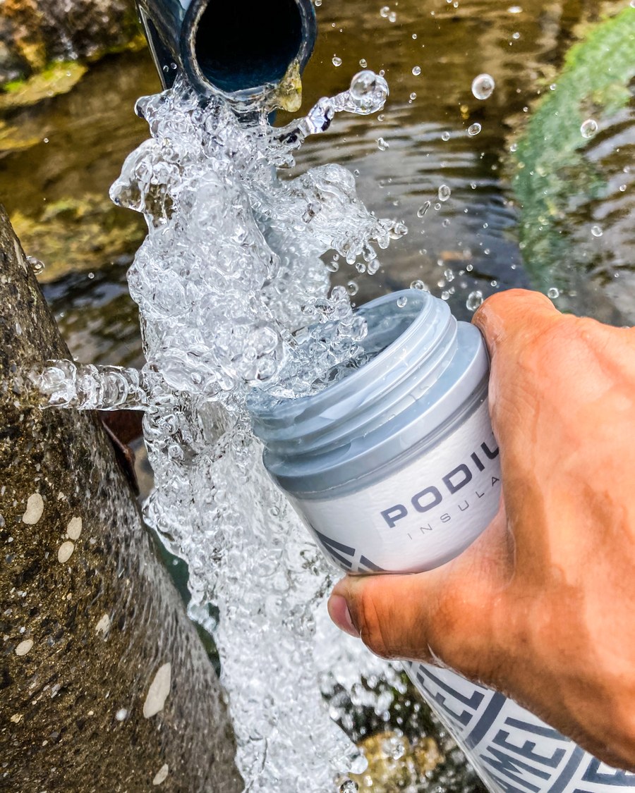 Drawing fresh natural spring water from the mountain into a FAR EAST bottle