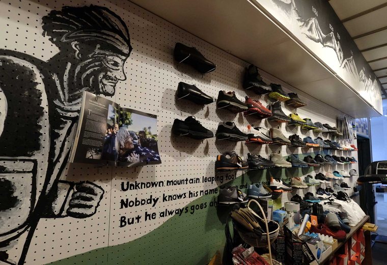 Trail-shoe wall at StrideLab
